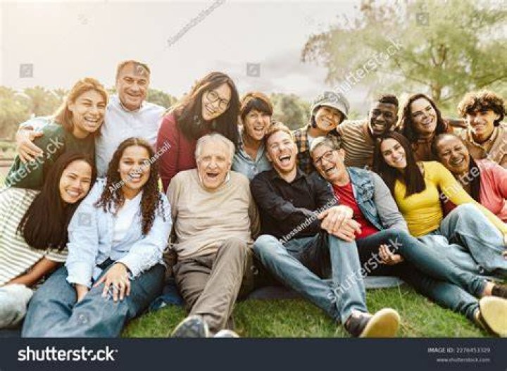 a group of people in green uniforms a group of people in green uniforms