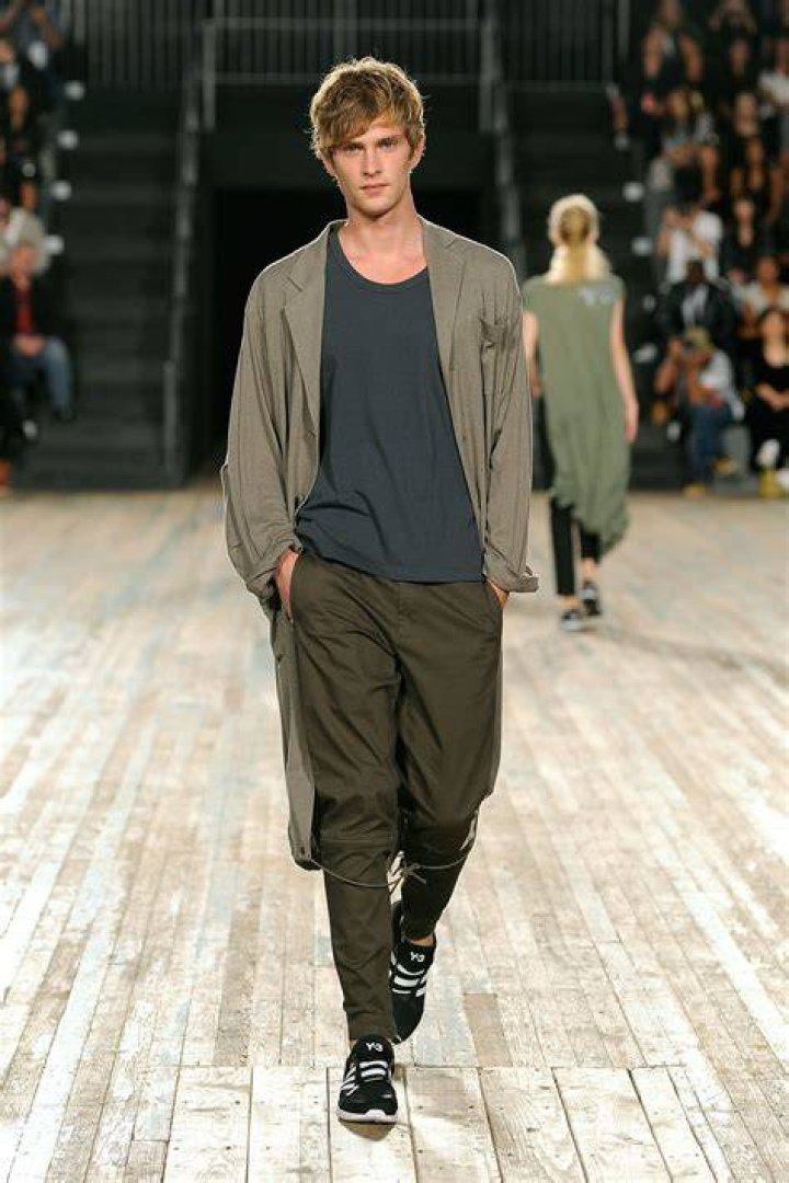 A male model walking down the Fendi runway