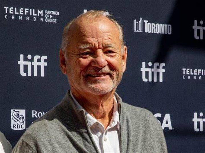 Bill Murray dressed like a zombie and Woody Harrelson in Zombieland