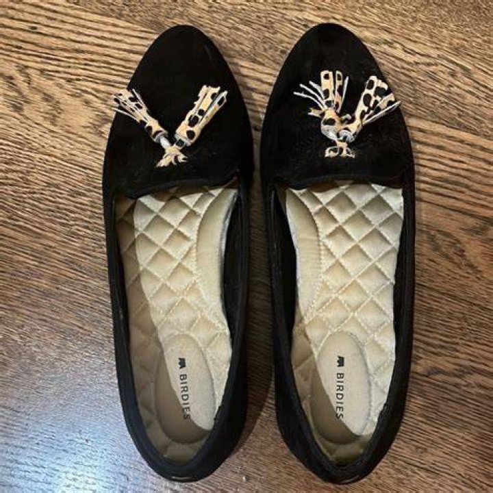 black birdies shoes with a pearl beaded cuff