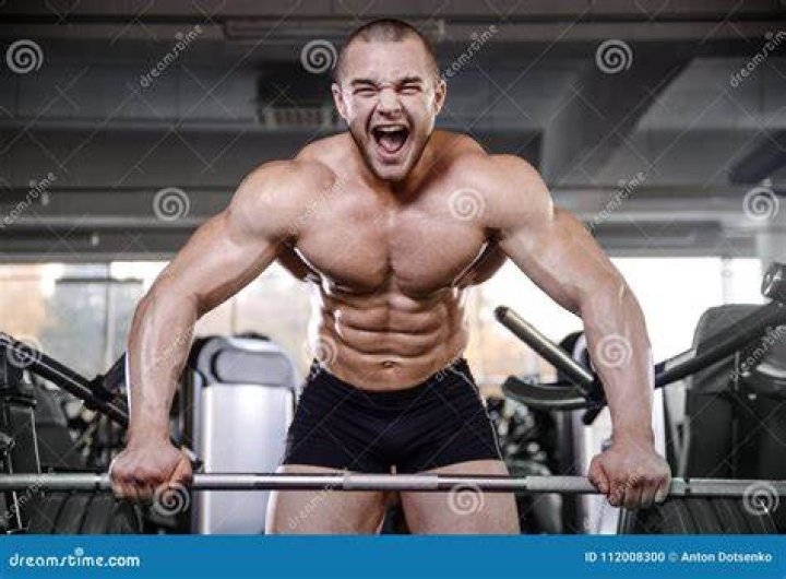 Brutal strong bodybuilder athletic men pumping up muscles with dumbbells Brutal strong bodybuilder athletic men pumping up muscles with dumbbells