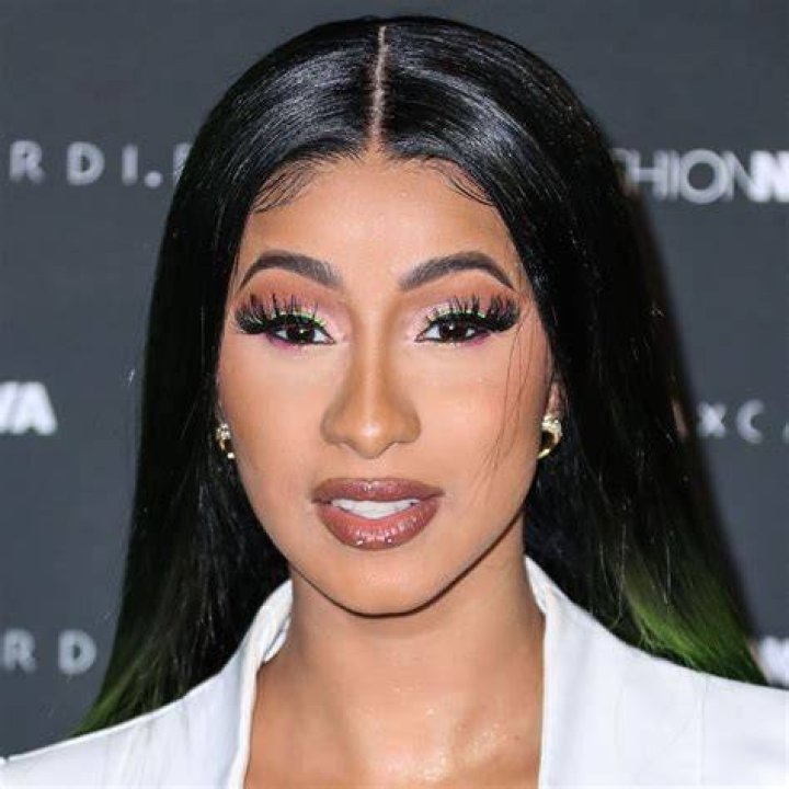 Cardi B flaunts her post lipo body and surgically enhanced breasts