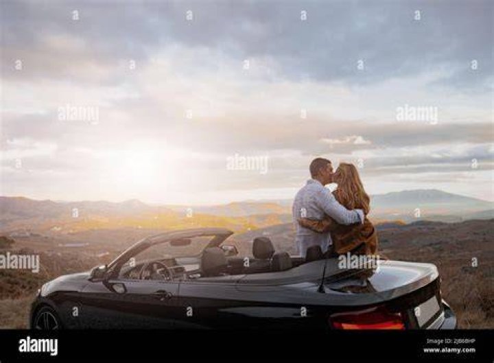 Couple kissing in a convertible couple kissing in a convertible