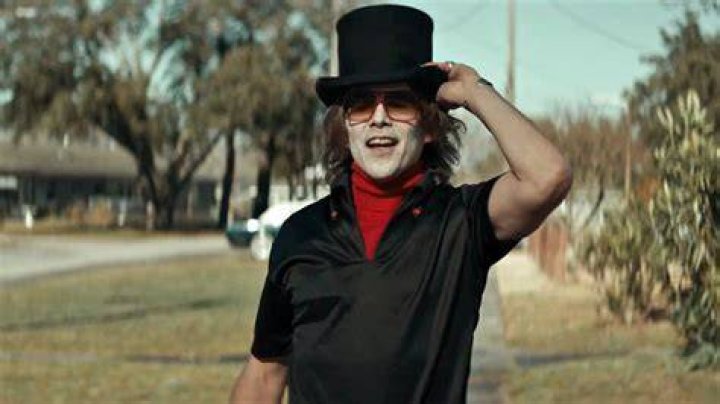 Ethan Hawke as The Grabber with a smiling mask in The Black Phone