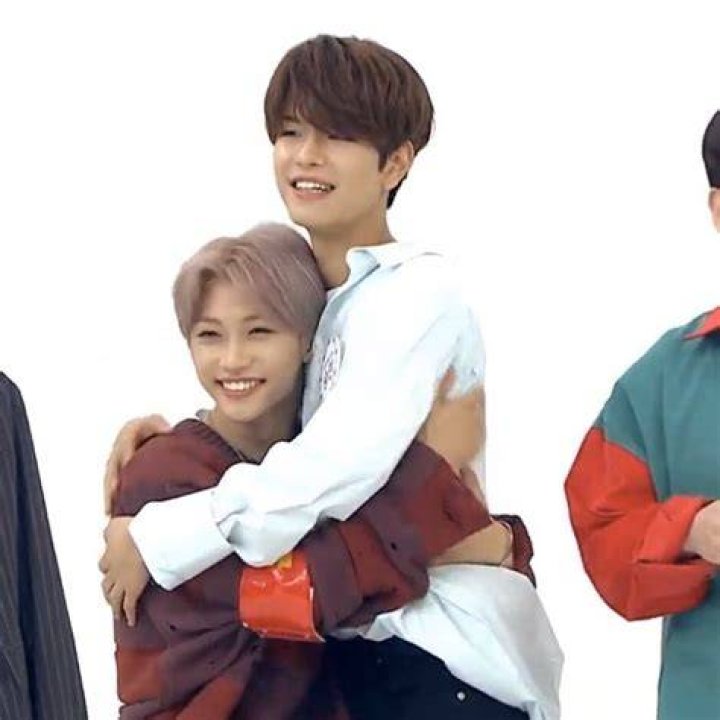 Felix and Victor hugging on the curb