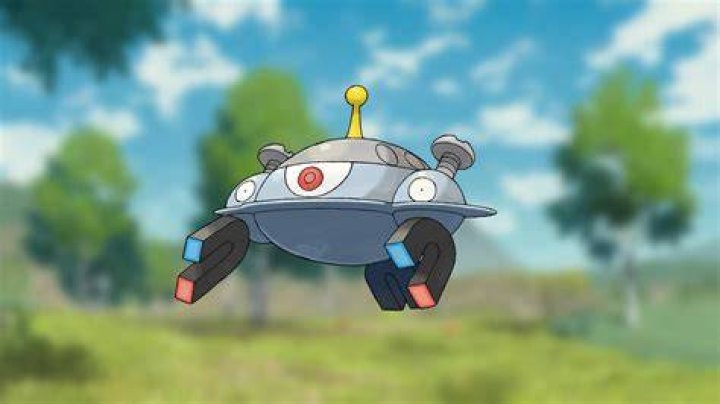 Magnezone floating in front of a Pokemon field.
