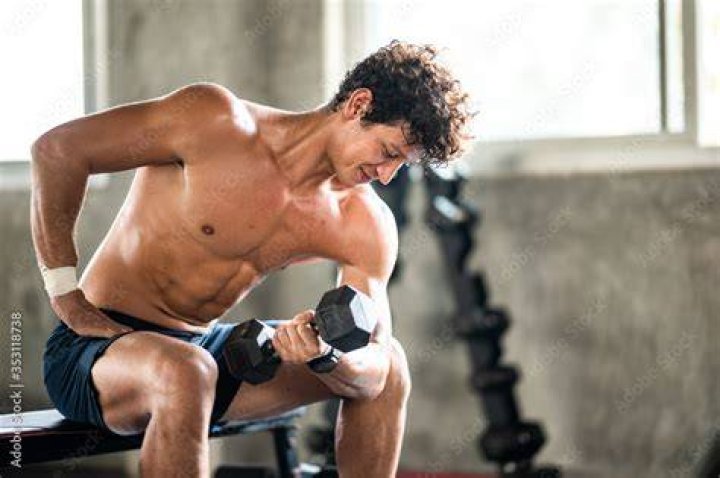 Man exercising in gym Man exercising in gym