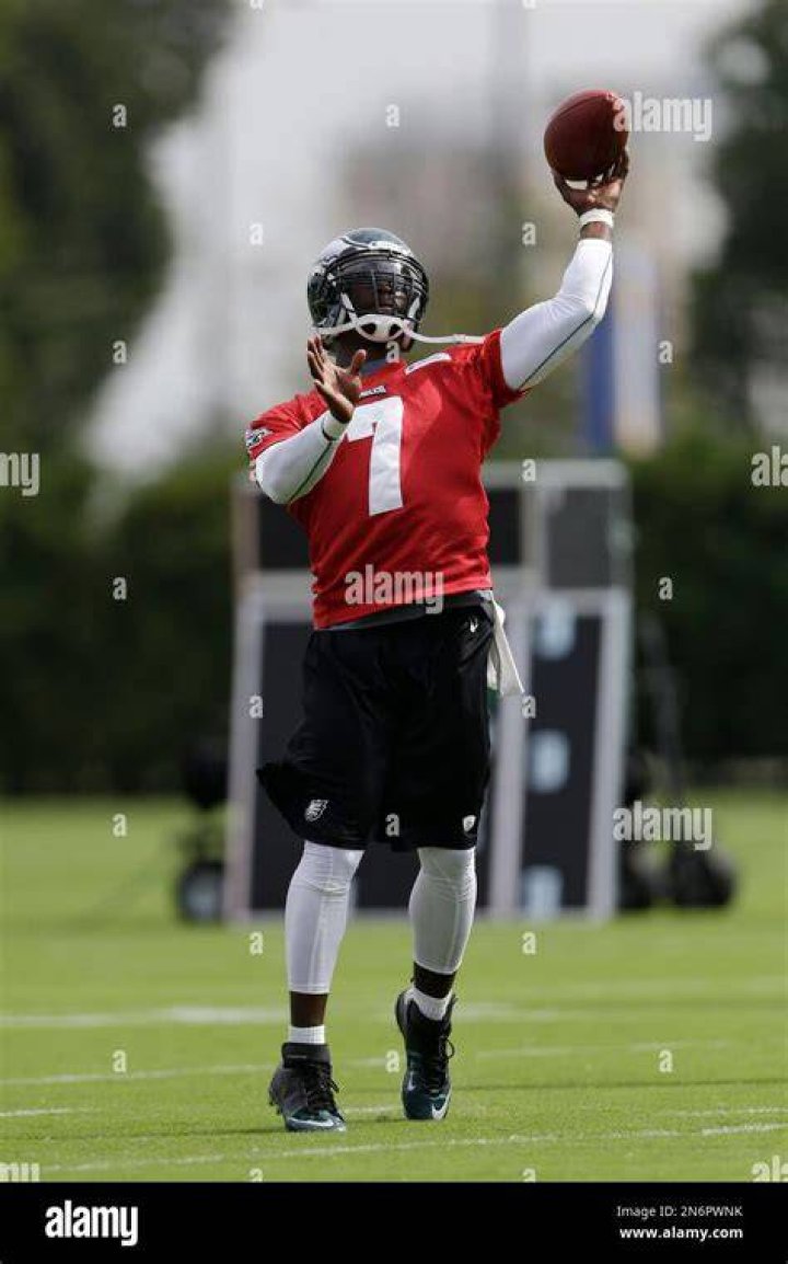 Michael Vick throws a football