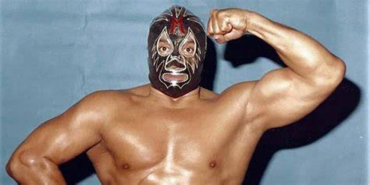 Mil Mascaras flexing in a promo photo