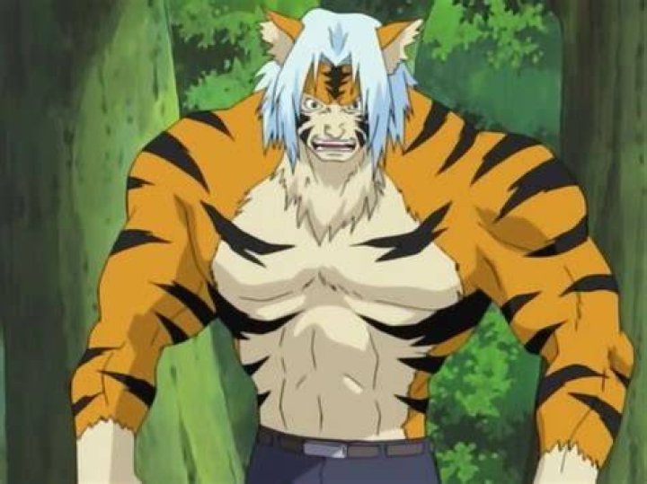 Mizuki, transformed into a tiger monster, grabs and throws Naruto in Naruto.