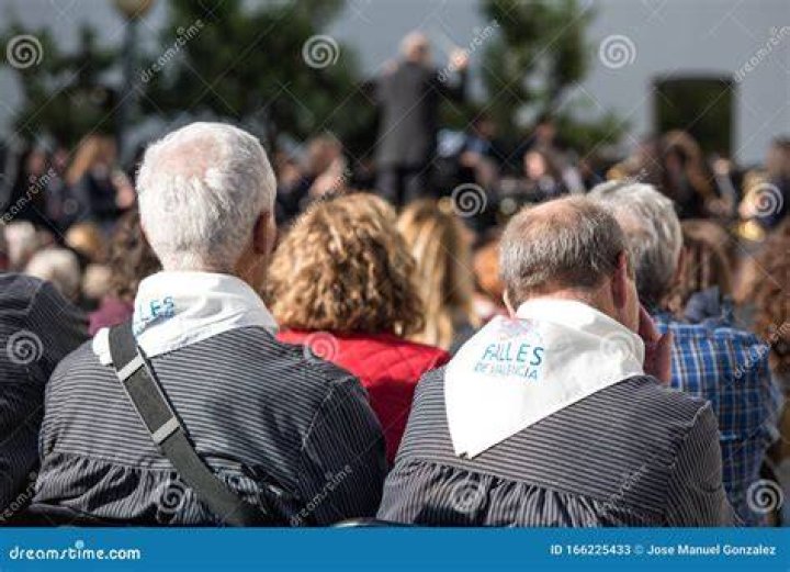 People are seen watching a presentation entitled No history in a room