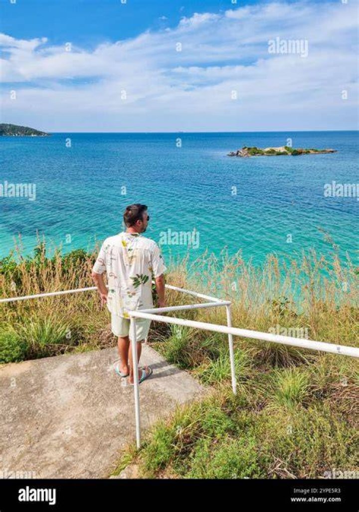 person overlooking lagoon in San Colombano, Italy