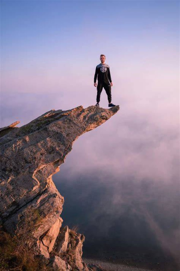 person standing on cliff