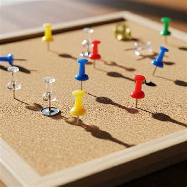 push pins reflecting light on a map