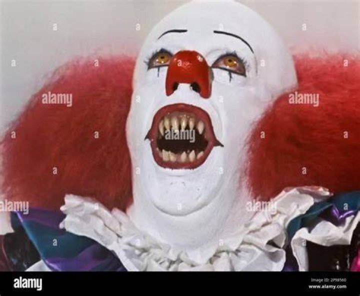 Tim Curry as Pennywise the Clown in IT 1990