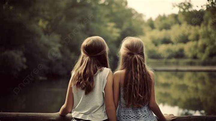 two girls looking over old ruins