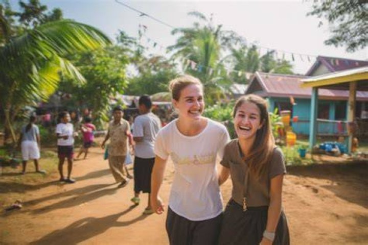 two girls volunteering abroad in high school in thailand