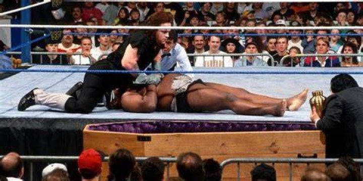 Undertaker pins Kamala in a Casket Match