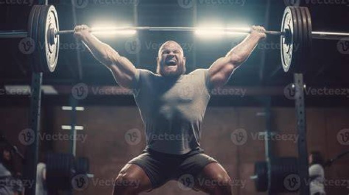 weightlifting strong man on a gym weightlifting strong man on a gym